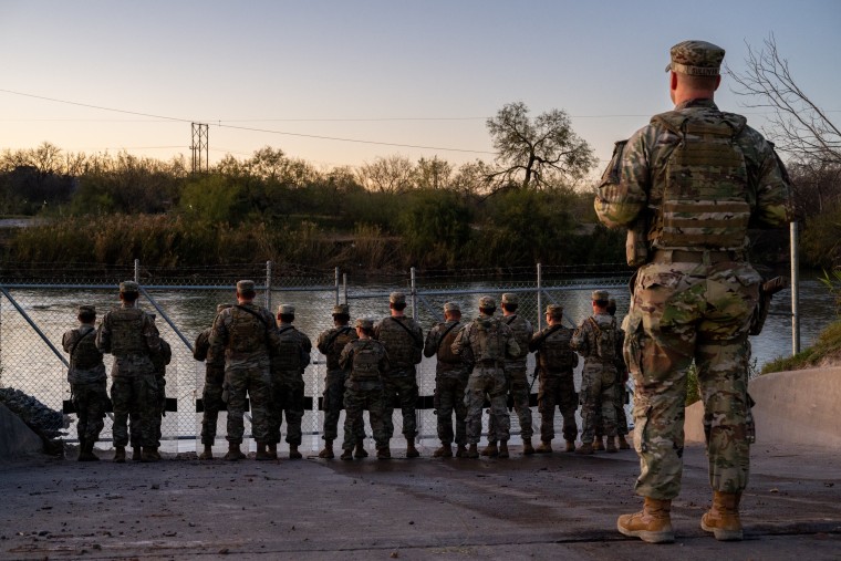 National Guard soldiers stand guard Jan. 12, 2024, on the banks of the Rio Grande at Shelby Park in Eagle Pass, Texas. 
