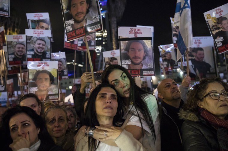 People rally to mark 100 days of captivity for hostages by Hamas in Gaza on Jan. 13, 2024 in Tel Aviv.