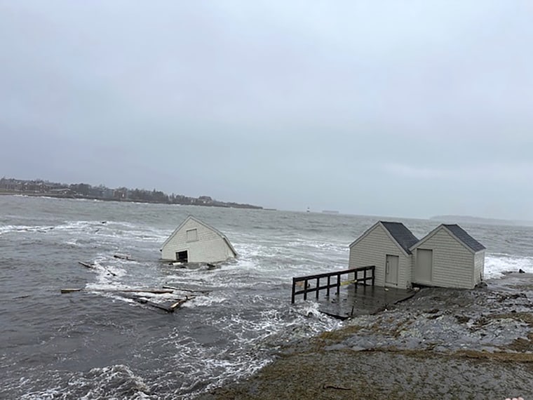 A fishing shack floats away into Casco Bay during a storm in South Portland, Maine, on Saturday.