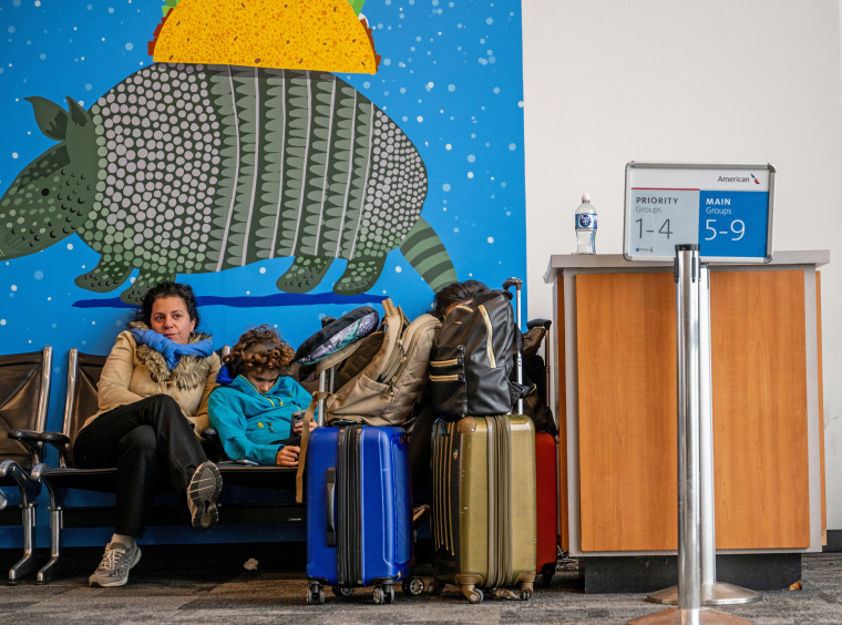 A family waits for their delayed flight at the Austin Bergstrom International Airport on Jan. 15, 2024 in Austin, Texas. 