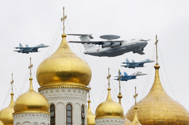 Aircraft fly over Red Square and the Kremlin during a military parade dress rehearsal in Moscow