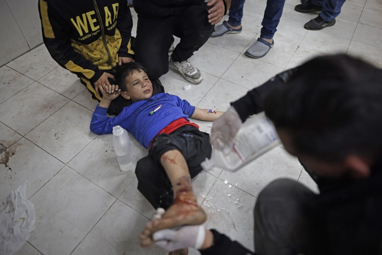A wounded Palestinian boy is treated in a hospital in Khan Younis, Monday, Jan. 15, 2024.