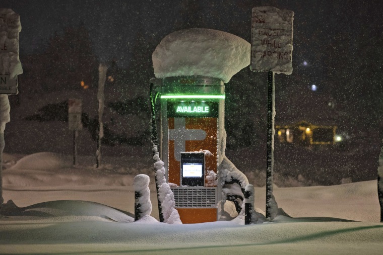 An EV charging station covered in fresh snow in Truckee, Calif., in 2022.