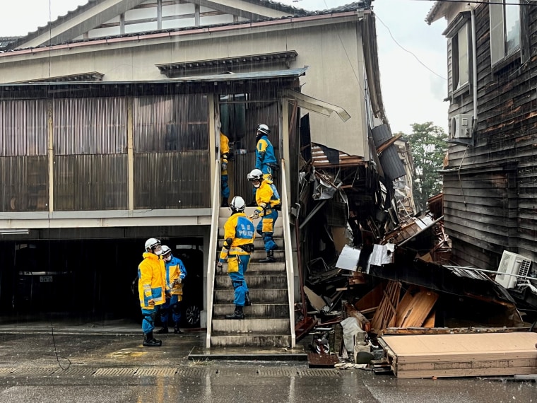 In Wajima, search-and-rescue crews went door to door to check damaged houses for survivors or bodies.
