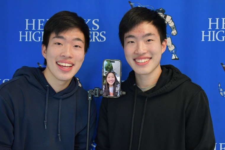 Herricks High School class of 2024 valedictorian and salutatorian Devon Lee (left) and Dylan Lee (right) celebrate the moment “virtually” with their sister.