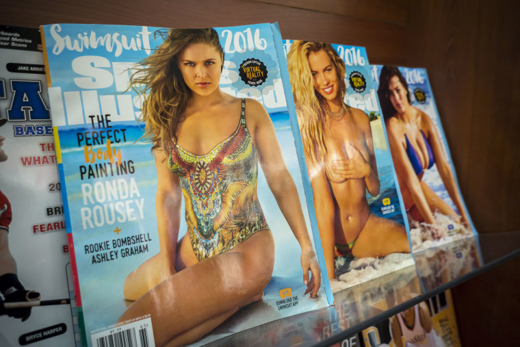 The Sports Illustrated 2016 swimsuit issue of the magazine is seen with other tabloid magazines displayed in a newsstand in New York.