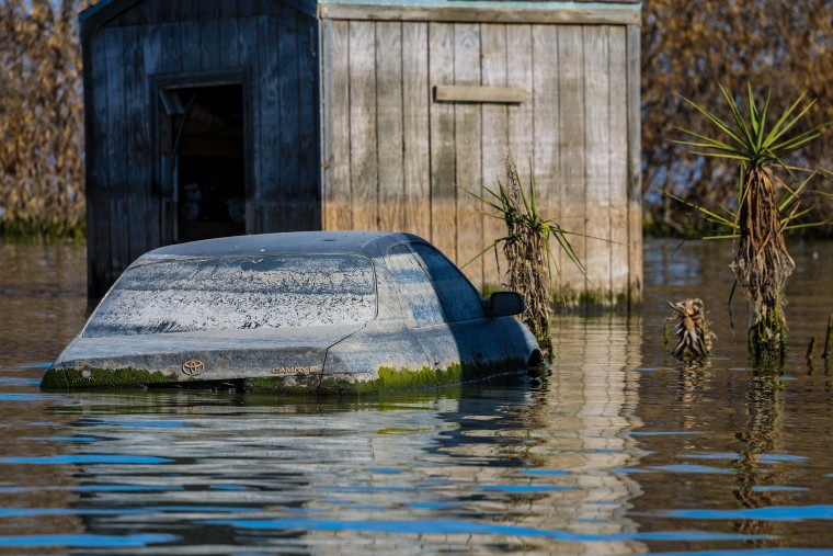 A vehicle underwater on the Racine St. Foster Farms chicken facility in Corcoran, Calif., on July 18, 2023.