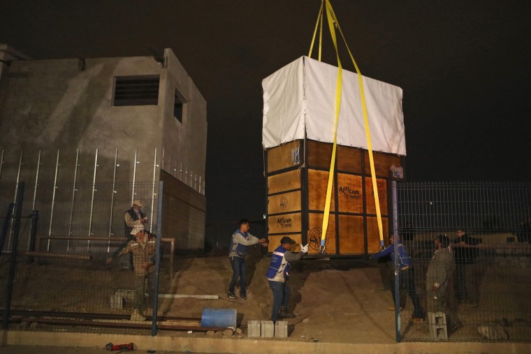 A transport crate containing Benito the giraffe is lifted during its transfer from Ciudad Juarez on January 21, 2024.
