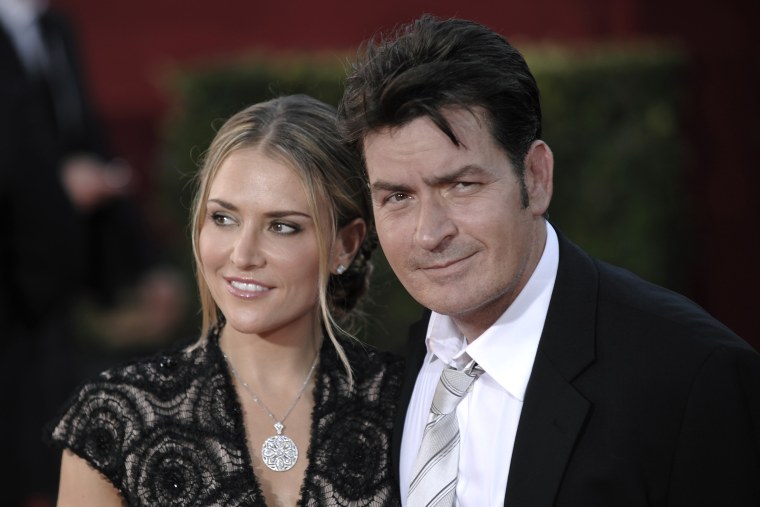 Charlie Sheen and then-wife Brooke Mueller arrive at the Emmy Awards in 2009.