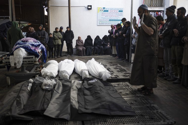 Palestinians pray next to the bodies of those who were killed in the Israeli ground offensive and bombardment of Khan Younis, outside a morgue in Rafah, southern Gaza, Wednesday, Jan. 24, 2024. Image: