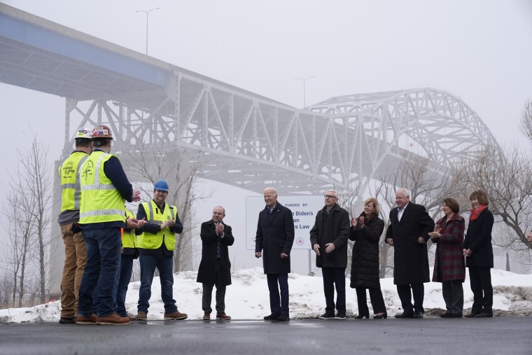 President Joe Biden speaks with iron workers and others near the John A. Blatnik Bridge between Duluth, Minn., and Superior, Wis., on Jan. 25, 2024.