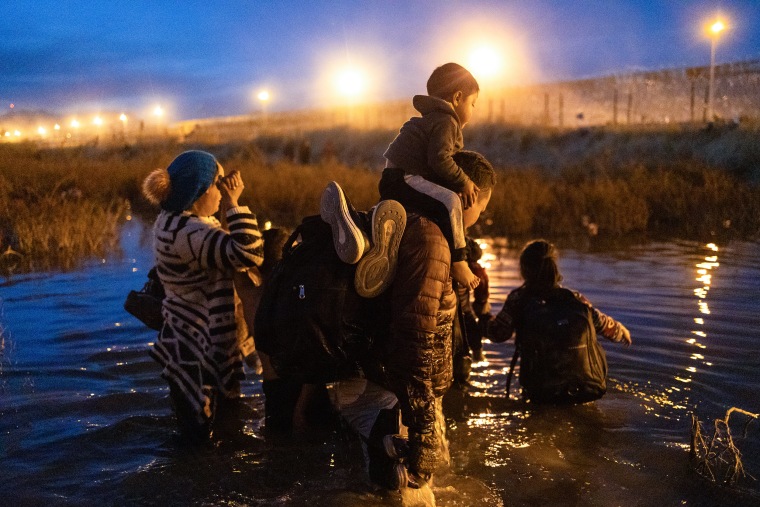 Migrants try to cross the Rio Grande River to the United States border