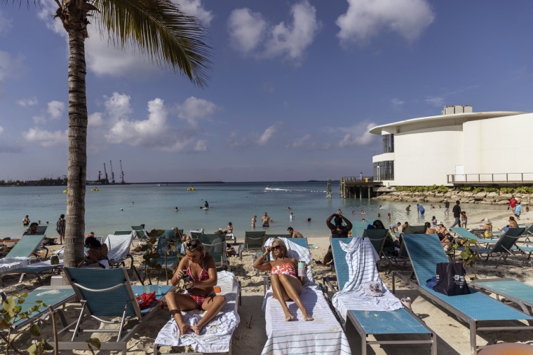 Tourists at a beach in Nassau, Bahamas