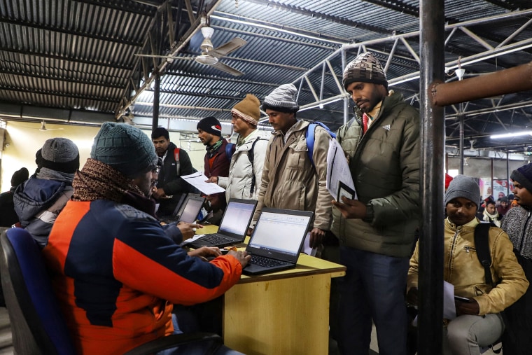 Indian workers submit registration forms seeking employment in Israel during a recruitment drive at the Industrial Training Institute in Lucknow, capital of India's Uttar Pradesh state on January 25, 2024. 