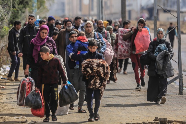 Palestinians evacuate the area of Nasser Hospital and the adjacent schools in Khan Younis on Jan. 29, 2024.