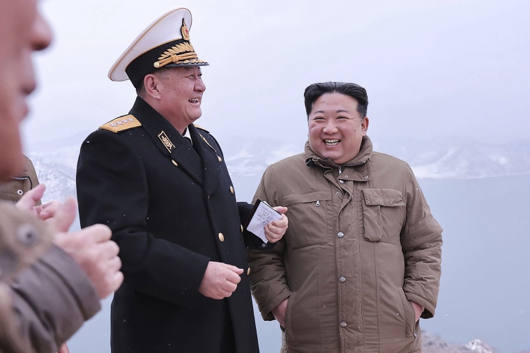 North Korean leader Kim Jong Un, right, inspecting a test-firing of the cruise missile Sunday in a photo provided by the North Korean government.