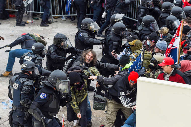 Ralph Celentano, center, clashes with police at the Capitol on Jan. 6, 2021.