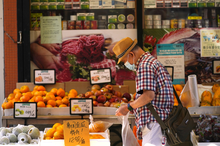 A customer shops for produce in the Chinatown neighborhood of Philadelphia