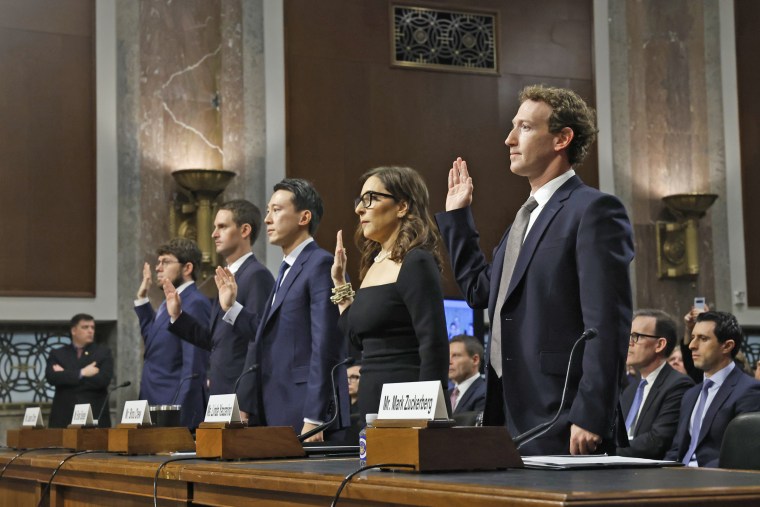 From left, Jason Citron, CEO of Discord, Evan Spiegel, CEO of Snap, Shou Zi Chew, CEO of TikTok, Linda Yaccarino, CEO of X, and Mark Zuckerberg, CEO of Meta, are sworn-in as they testify before the Senate Judiciary Committee on Jan. 31, 2024.