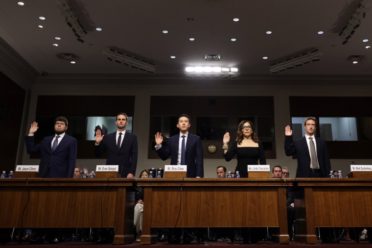 From left, Jason Citron, Evan Spiegel, Shou Zi Chew, Linda Yaccarino, and Mark Zuckerberg are sworn in as they testify before the Senate Judiciary Committee