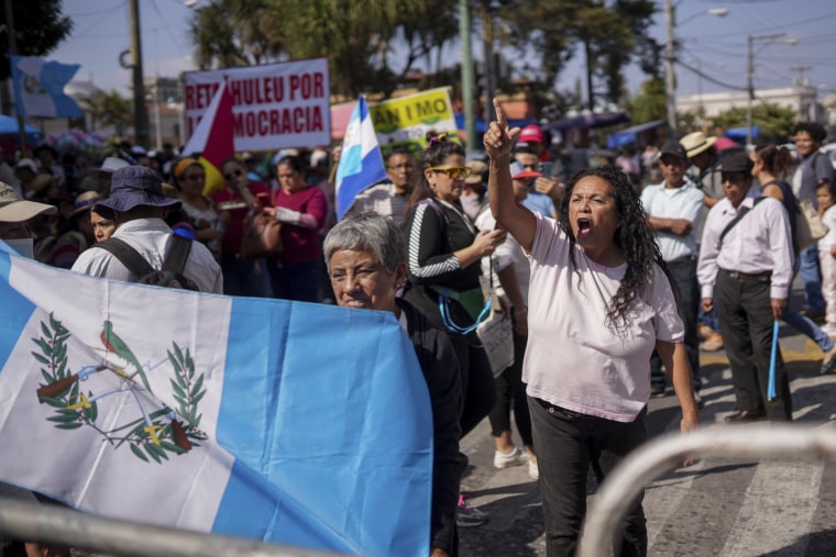 Supporters of Guatemalan President-elect Bernardo Arévalo protest a delay in the start of the legislative session to swear-in new lawmakers on Arévalo's inauguration Day, outside Congress in Guatemala City, Sunday, Jan. 14, 2024.