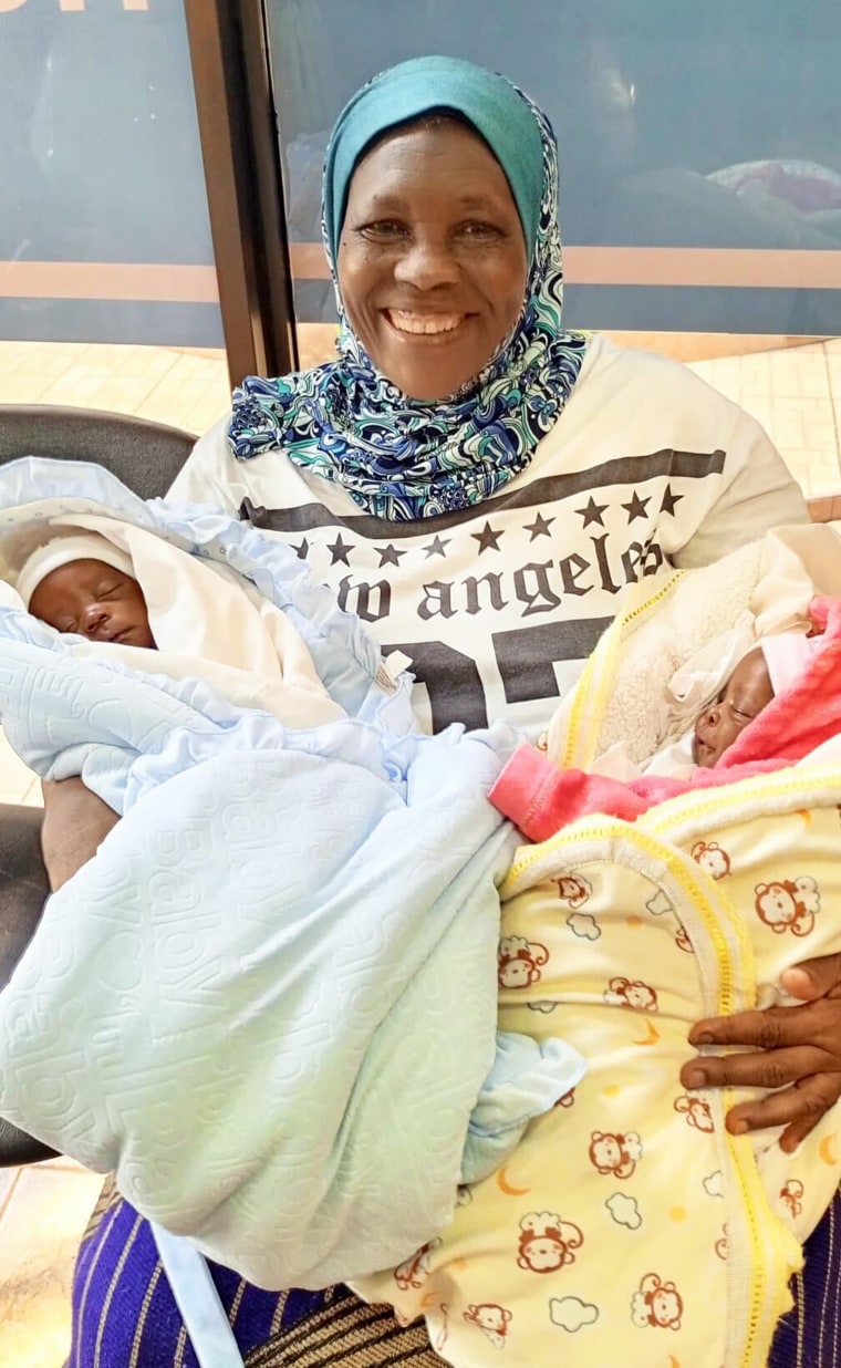 Safina Namukwaya, 70,  posed with her 5-week-old twins, Kato and Babiyre.