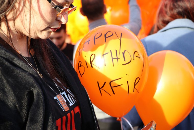 Balloons were released into the sky at an event marking Kfir Bibas' first birthday as he remains in Hamas' captivity.