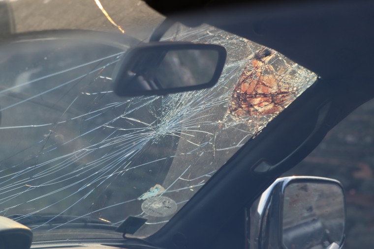 Blood smeared on the broken windshield of the car Tawfic Hafeth Abdel Jabbar was in when he was shot.