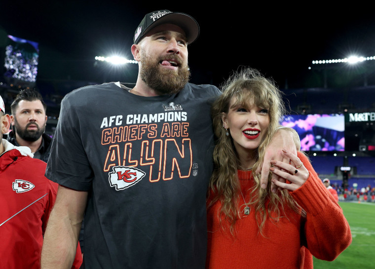 Travis Kelce of the Kansas City Chiefs celebrates with Taylor Swift after a 17-10 victory against the Baltimore Ravens in the AFC championship game on Jan. 28, 2024.