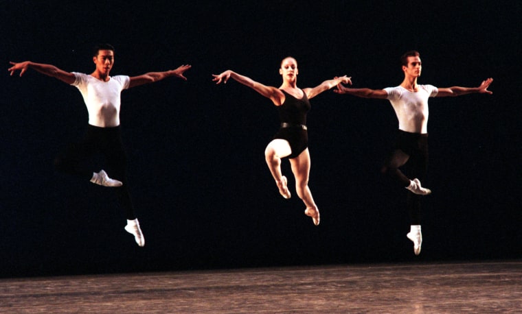 Edward Liang, Maria Kowroski, and Benjamin Millepied of the New York City Ballet leap as they perform the Agon at the Orange County Performing Arts Center in Costa Mesa, California, on 	Oct. 14, 1998.