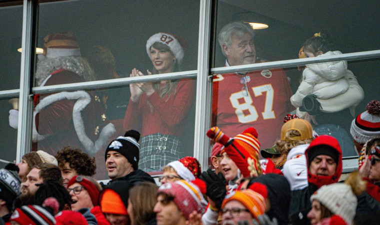 Taylor Swift watches the Kansas City Chiefs play the Las Vegas Raiders in a suite with Travis Kelce's father, Ed Kelce, Monday, Dec. 25, 2023, at GEHA Field at Arrowhead Stadium, Kansas City, Missouri. 
