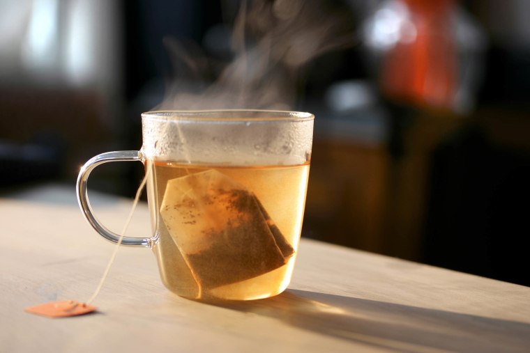 Tea Bag In A Glass Cup Filled With Hot Water.