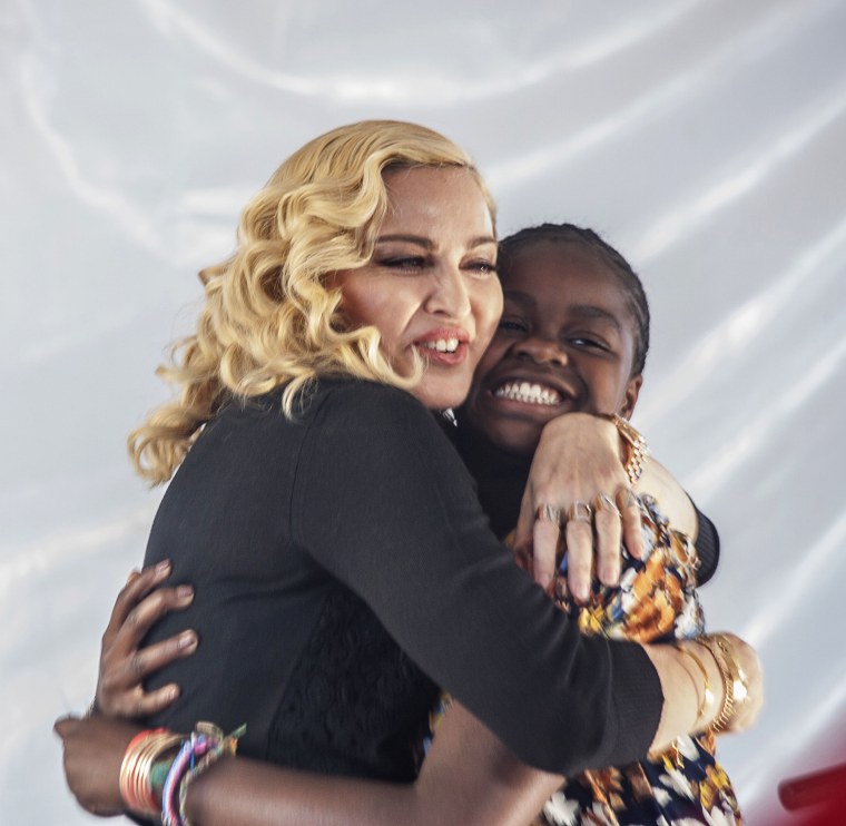 Madonna (L) hugs her Malawian adopted daughter Mercy James after she made a speech during the opening ceremony of the Mercy James Children's Hospital at Queen Elizabeth Central Hospital in Blantyre, Malawi, on July 11, 2017.