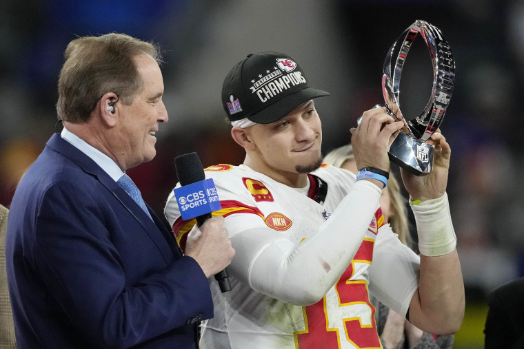 Patrick Mahomes holds Lamar Hunt Trophy after the Chiefs won the 2024 AFC championship game.