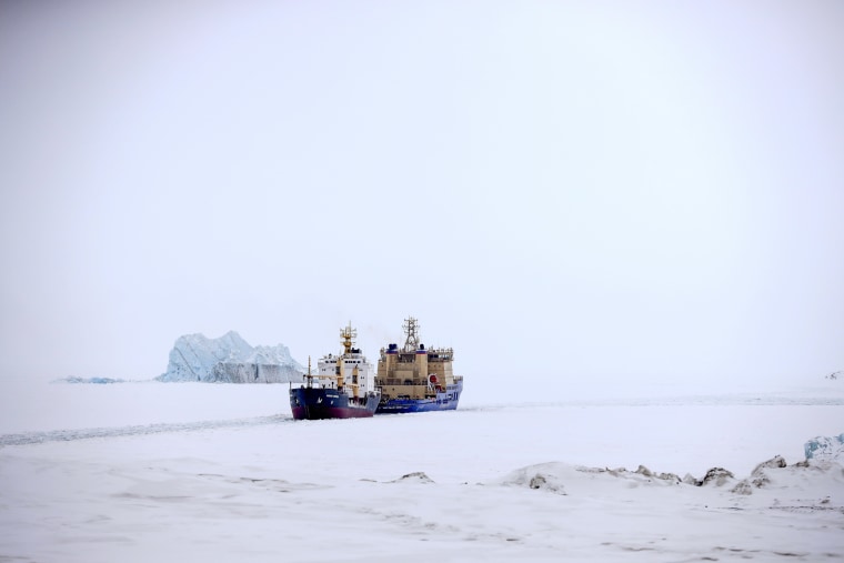 Image: An icebreaker clears path for cargo ship in Russia.