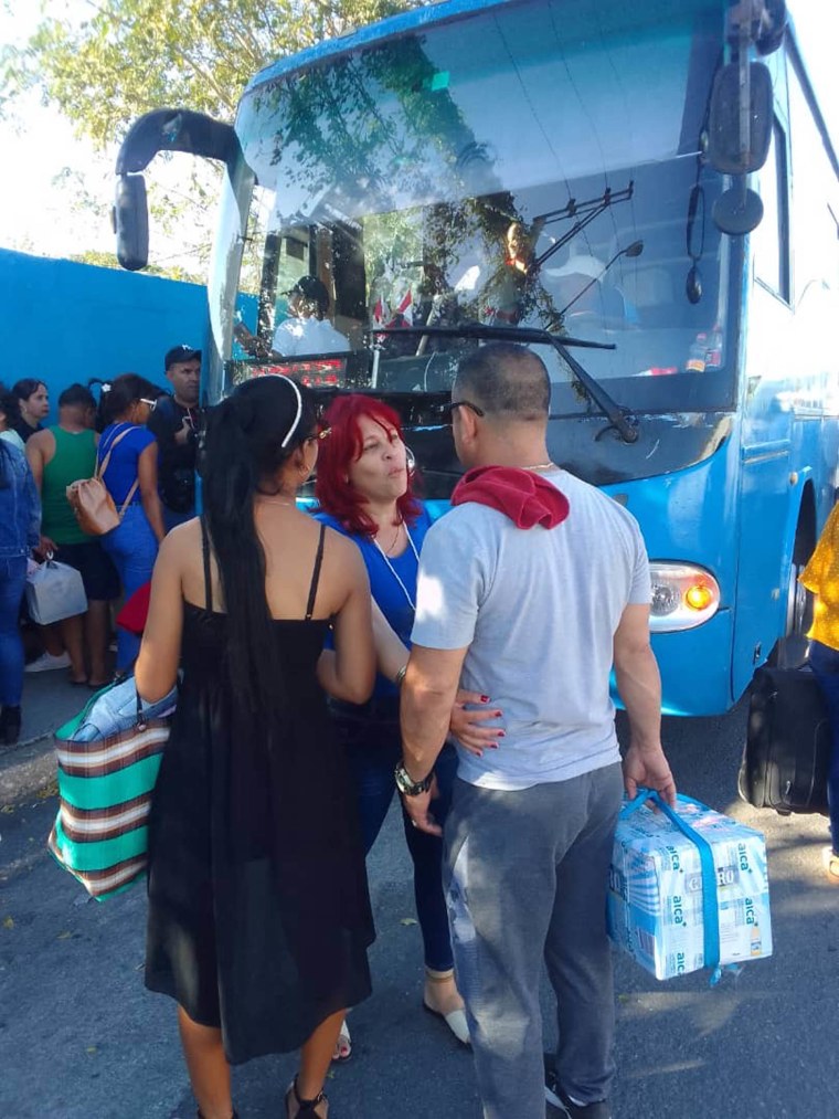 Lisset Velez boards a private bus in Havana, Cuba on Sunday, January 28, 2024. 

