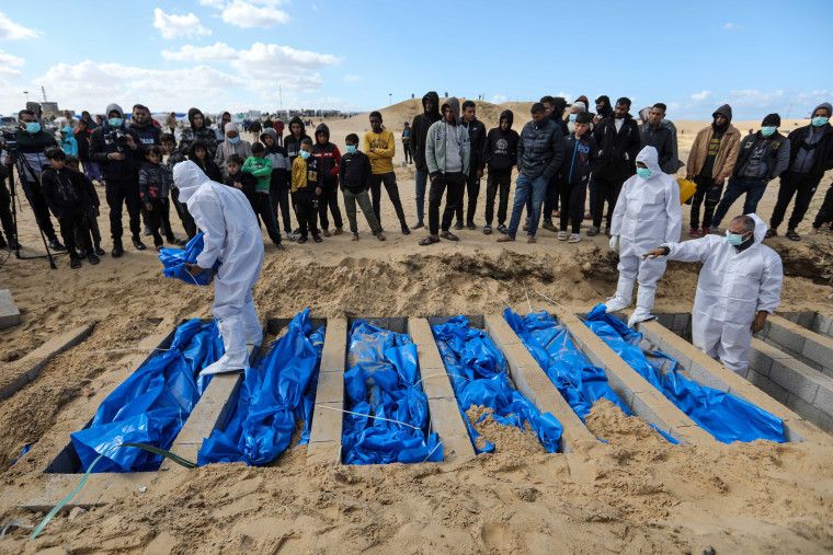 The bodies of Palestinians killed during the war are buried in a mass grave on January 30, 2024 in Rafah, Gaza. 