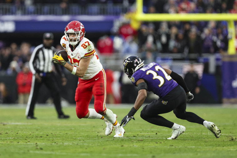 Travis Kelce runs the ball during the AFC Championship NFL football game against the Baltimore Ravens at M&T Bank Stadium on January 28, 2024.