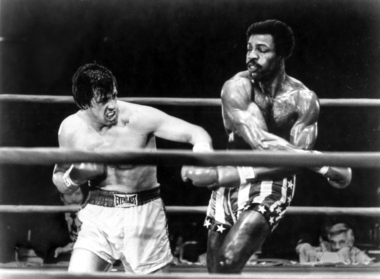 Sylvester Stallone and Carl Weathers perform a boxing scene in the movie "Rocky" in 1977