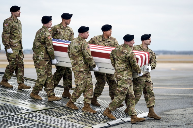Image: An Army carry team moves the transfer case containing the remains of U.S. Army Sgt. Kennedy Ladon Sanders, 24, of Waycross, Ga., 