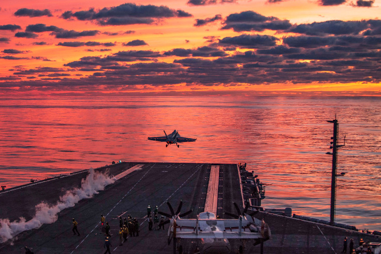 The F/A-18E Super Hornet takes off from the deck of the USS Dwight D. Eisenhower.