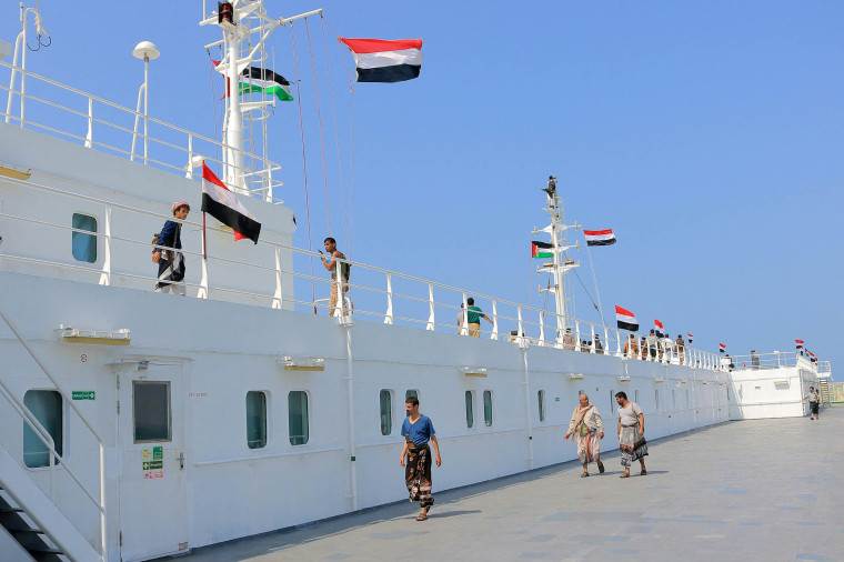 An organized tour by Yemen's Huthi rebels (on board) on Nov. 22, 2023 shows the Galaxy Leader cargo ship, seized by Huthi fighters two days earlier, docked in a port on the Red Sea in the Yemeni province of Hodeida.