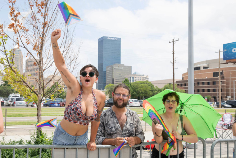 Shawnasea Laehn, Mac Seigel, Emil Winter show their support for the the annual Pride Alliance Pride Parade in Downtown Oklahoma City on June 25, 2023.