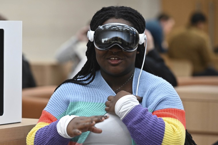 A customer with an Apple Vision Pro mixed reality (XR) headset at the Apple Fifth Avenue store in New York City.