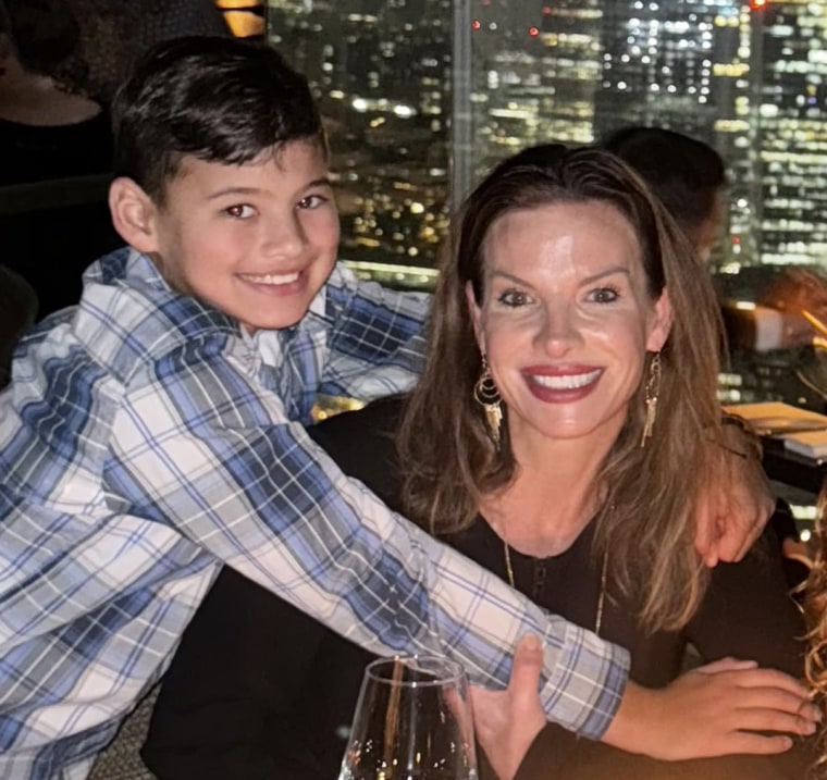 Wendy Steele with her son Colton smile at a restaurant.