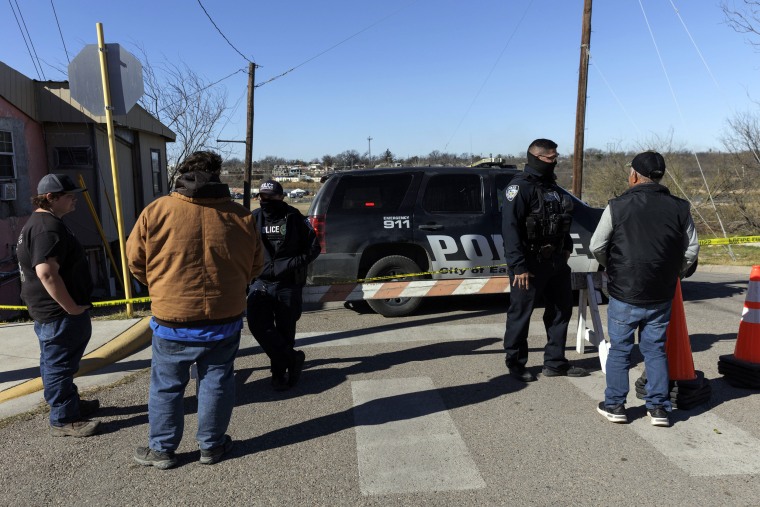 Police officers at a barricade leading to Shelby Park in Eagle Pass, Texas