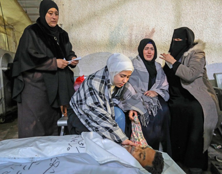 Mourners collect the bodies of friends and relatives on Feb. 6, 2024 in Rafah, Gaza. 