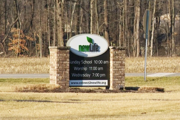 A sign outside New Life Church with hours of operation.