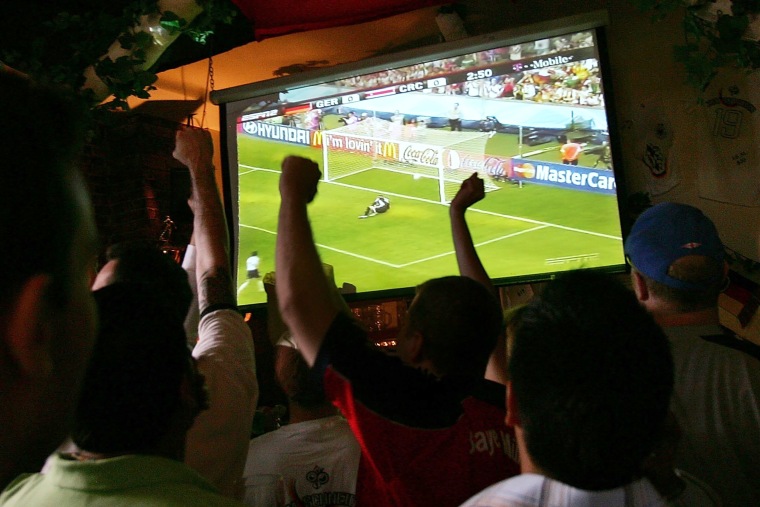 soccer fans happy reaction react arms up tv television sports bar