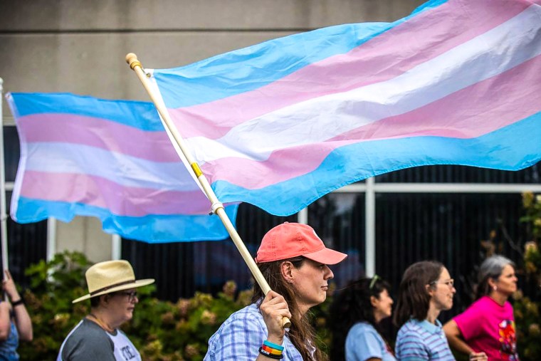 A woman attends a rally in support of trans youth in schools 
